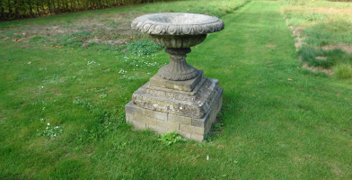 A 19th century fountain vase in composition stone