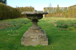 A 19th century fountain vase in composition stone