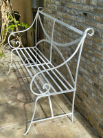 A wrought iron garden seat