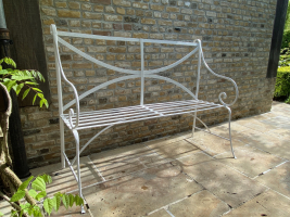 A wrought iron garden seat